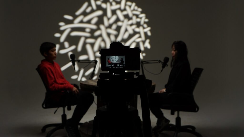 an interview taking place in a dimly lit room an interview taking place in a dimly lit room