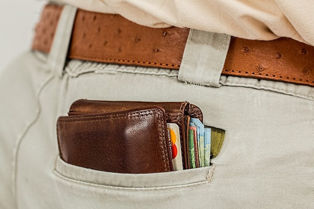 Man with a wallet in his trouser pocket Man with a wallet in his trouser pocket