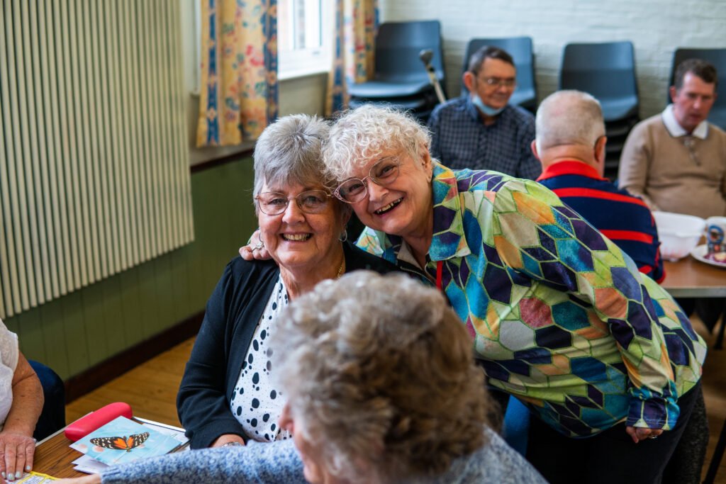 Friends connecting over a game of bingo Friends connecting over a game of bingo