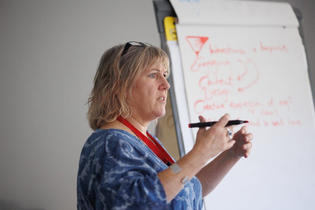 a woman teaching a class a woman teaching a class