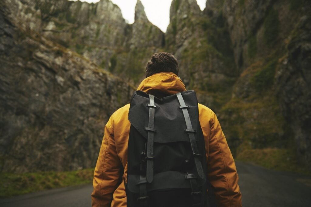 A man backpacking through mountains A man backpacking through mountains